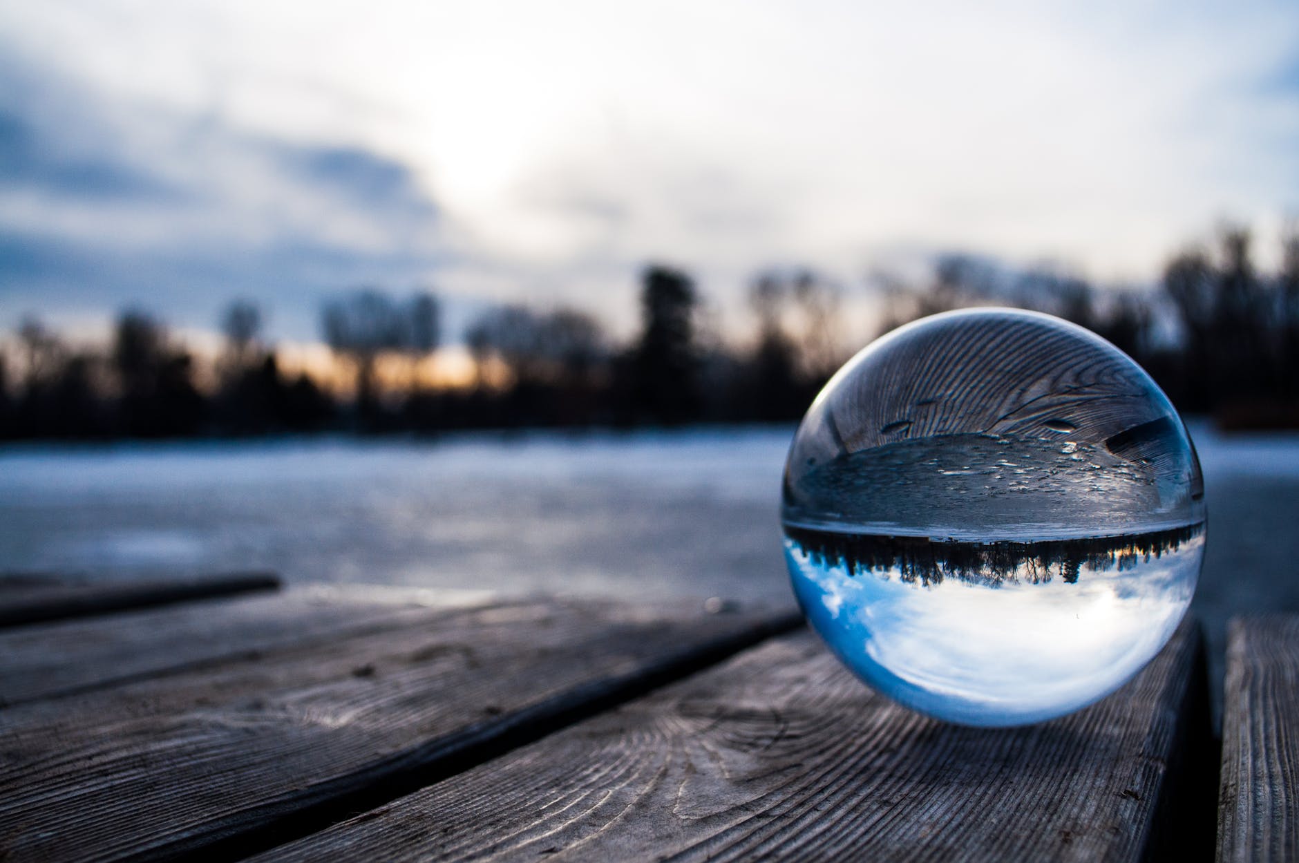 toy marble on brown wooden surface